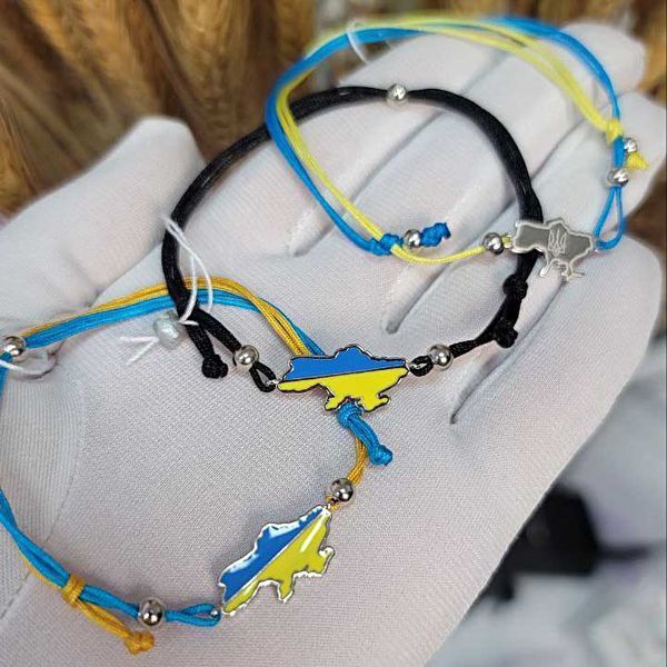 Серебряный браслет с желто - голубым шнурком Единая Украина 039377 039377 фото