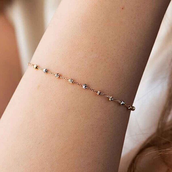 Золотий браслет з ажурними кульками в комбінованому золоті 039116 детальне зображення ювелірного виробу Золотий браслет з ажурними кульками в комбінованому золоті 039116 детальне зображення ювелірного виробу