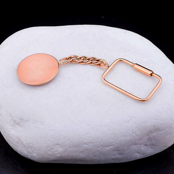 Золотой брелок с синей эмалью Mazda фото Золотой брелок с синей эмалью Mazda фото