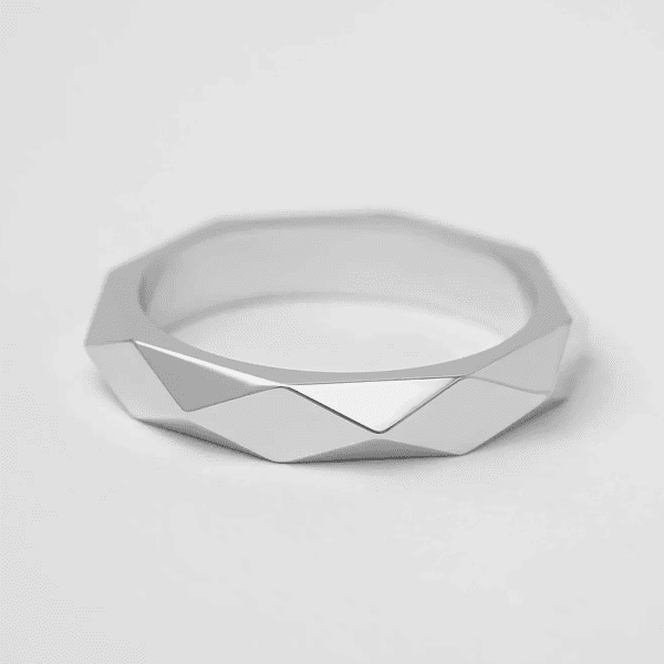 Жіноча сучасна обручка з випуклими гранями симетрична у білому золоті купити Жіноча сучасна обручка з випуклими гранями симетрична у білому золоті купити