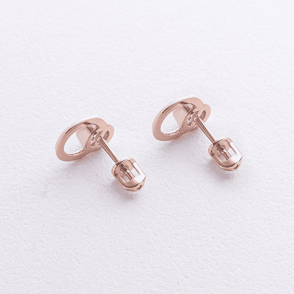 Лаконичные пусеты в красном золоте с голубым топазом круглой огранки и геометрическим круглым элементом