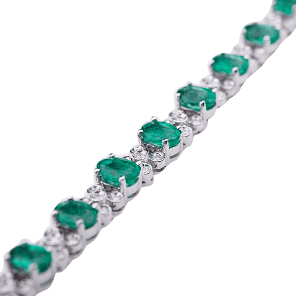 Золотой браслет с изумрудными и бриллиантовыми вставками  Золотой браслет с изумрудными и бриллиантовыми вставками