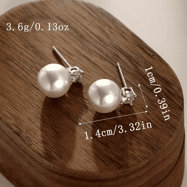 Элегантные серьги-пусеты с жемчугом и фианитами купить Элегантные серьги-пусеты с жемчугом и фианитами купить