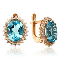 обзорное фото Золотые серьги овальной формы с голубым топазом и фианитами 035885  Золотые серьги