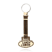 обзорное фото Золотой брелок для ключей с логотипом LandRover 036492 Брелок из золота обзорное фото Золотой брелок для ключей с логотипом LandRover 036492  Брелок из золота