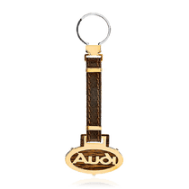 обзорное фото Золотой брелок с кожей марка авто Audi 036489 Брелок из золота обзорное фото Золотой брелок с кожей марка авто Audi 036489  Брелок из золота