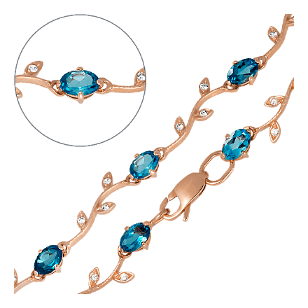 Женский золотой браслет украшенный голубыми и белыми топазами 